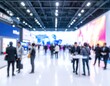 © karina - Blurred Crowd Walking Inside Modern Exhibition Hall.