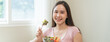 © Pormezz - Happy wellness meal, Woman eats salad as lunch and controls calories for the meal for her body care