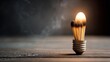 © Santi - Burned matchstick arranged in light bulb shape on wooden surface, creative concept, smoke rising, symbolizing burnout, innovation, and idea exhaustion