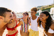 © Xavier Lorenzo - Happy diverse friends enjoying refreshing summer vacation at beach. Millennial multiracial people having fun during holidays. Friendship concept