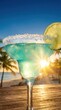 © Andrey - Tropical blue margarita with salt rim and lime slice, set against a vibrant sunset beach background, capturing the essence of a summer vacation