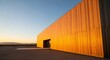 © Bali Adventure Co - Modern Wooden Building in Desert Landscape at Sunset
