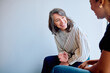 © we.bond.creations - Two women engaging in a friendly and supportive conversation, sharing laughter and positive communication