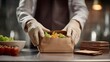© ModernFiles - Realistic fast food concept shot of multiple white plastic takeout bags being handed from restaurant worker inside window to impatient driver in compact car, street and vehicles streaked behind