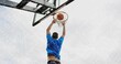 © vectorfusionart - Jumping basketball player dunking basketball toward hoop on court, in blue shirt and dark shorts