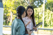 © Wanda - Two businesswoman work taking outside office