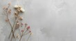© VRVisionary - Minimalist wedding card design featuring dried flowers on cool gray textured surface
