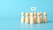 © guluartist - A conceptual digital illustration representing individuality, communication, and teamwork. A row of ten wooden figurines stands upright against a light blue background, resembling abstract human figur