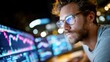 © keks20034 - Focused financial analyst reviewing market data in modern office