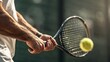 © Planetz - A close-up of a tennis player hitting a tennis ball with a racket during a match or practice session.