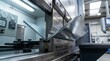 © Wahyu - Precision metal bending with a hydraulic press brake machine.