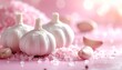 © ruangrit19 - Garlic bulbs and pink sea salt composition for wellness and beauty concept aromatherapy background bright and dreamy aesthetic.