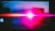 © AA - A vibrant light beam shines brightly in a dark room with colorful reflections