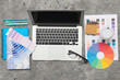 © Pixel-Shot - Laptop with color palettes on grunge background. Graphic design concept