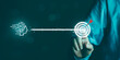 © 0202supaporn_studio  - AI driven automation, data analysis, and smart decision making for achieving business objectives and performance growth. Business hand connecting artificial intelligence system to target goal.