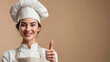 © Tatsiana - Talented female chef smiling and giving thumbs up in a well-lit kitchen setting