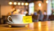 © Shoaib - Coffee Cup with 'LET'S TALK' Sticky Note on Wooden Table in Cafe