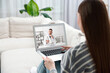 © New Africa - Telemedicine. Woman having online video consultation with doctor via laptop at home