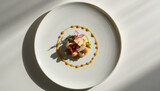 Elegant plated fine dining dessert with edible flower garnish and sauce ring