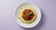 © Marium - Delicious beef stew served over couscous with fresh vegetables garnished with parsley on a white plate