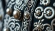 © chi - charro. Close-up of intricate silver embroidery and buttons on a traditional suit jacket. lifestyle magazines, social media lookbooks, designed for influencer and brand collaborations.