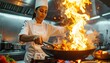 © Hilda Shop  - Female chef cooking with fire in a professional kitchen.