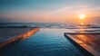 © Nasreen - Luxury outdoor infinity swimming pool overlooking sea ocean beach at sunset sunrise time, tranquil tropical resort travel destination with glowing sky reflections, serene vacation atmosphere, scenic c