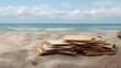 © Thares2020 - A stack of old weathered letters rests on a sandy beach with the ocean and sky in the background