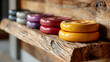 ©  VladaToday - Wooden weight rack with colorful gym plates for home fitness equipment storage display
