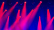 © Milou Dirks - red and pink light beams on blue stage during music concert