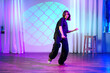 © fotofabrika - Dance performance in a colorful studio with unique lighting, showcasing expressive movements and creative style