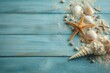 © karina - Seashells, starfish, and sand artfully arranged on weathered blue wooden planks