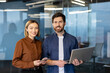 © Liubomir - Successful business people standing at modern office