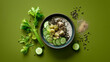 © AS_SleepingPanda - A healthy bowl of food with cucumber slices, celery, and seeds is presented on a green background