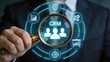 © Mia - Businessman using a magnifying glass to analyze CRM customer relationship management data on a virtual holographic interface focusing on sales strategy client retention marketing