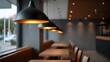 © Thares2020 - A row of modern black pendant lights illuminates tables and seating in a minimalist cafe with a warm ambiance