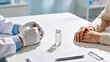 © KAI - Hands of Doctor and Female Patient Hands at Desk with Vial in Modern Clinic