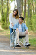 © auremar - senior couple with wheelchair in autumn forest
