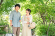 © buritora - Young couples enjoying walking tours and sightseeing in their home country.