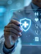 © WU - Digital health insurance and medical protection concept with business professional verifying healthcare coverage policy on interface, representing safety, family protection, healthcare benefits