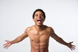 © AC - Joyful Expression of a Fit Male Model Embracing Body Positivity and Celebrating Success with Enthusiasm in a Studio Portrait