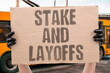 © AndriiKoval - 'Stake And Layoffs' Startup workers must learn to protect their stake because layoffs reset vesting clocks. STAKE. PROTECT. STARTUP. VESTING. LAYOFFS.