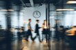 © Ruslan - Busy modern office with blurred figures and clock