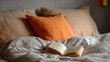 © Pedro - Cozy bedroom with an open book on the bed, inviting relaxation.