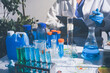 © Sirikarn Rinruesee - Science, laboratory and woman with pipette, test tube and biotech solution in research. Medical innovation, scientist or lab technician in study for healthcare, medicine and vaccine results feedback.