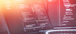© Maximusdn - Futuristic Software Coding Workspace with Warm Gradient Light Overlay and Source Code on Screens