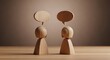© florynstudio3 - Wooden figures converse, speech bubbles above. Warm lighting, simple composition, dialogue implied