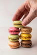 © Stacy Howell - Stack of multi colored macaroons on a light surface