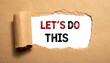 © NJAREM - Torn paper reveals text 'LET'S DO THIS' written in red and black. It's an inspiring message. The background is a crisp white