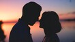 © Josna - Romantic couple silhouettes almost touching noses during a beautiful vibrant sunset